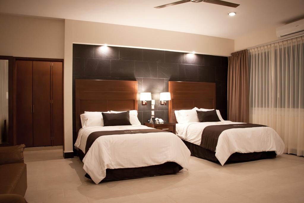 Hotel Ecce Inn & Spa Silao Quarto foto A bedroom at the hotel